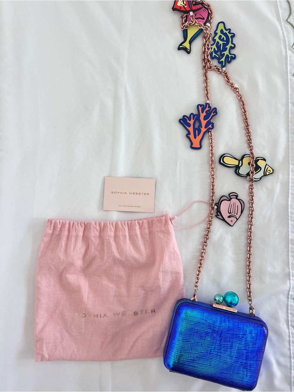 Sophia Webster iridescent blue box clutch with pink dust bag